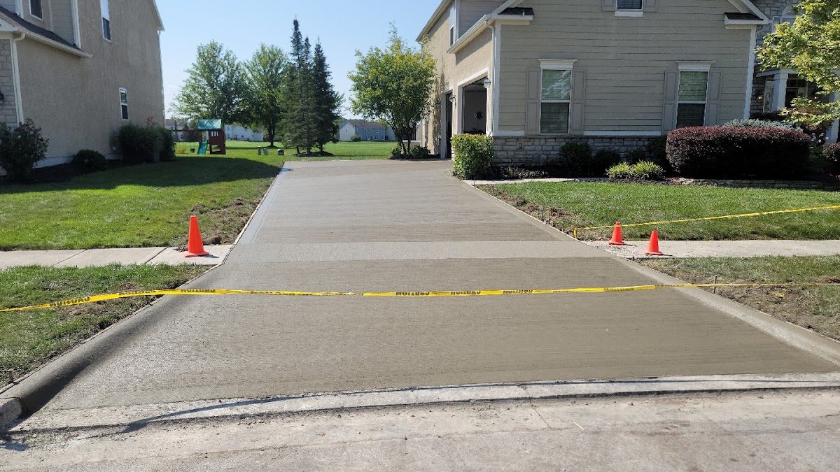 Freshly poured concrete driveway sectioned off with caution tape